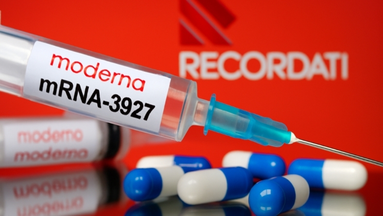 Syringe labeled Moderna mRNA-3927 with Recordati logo in background