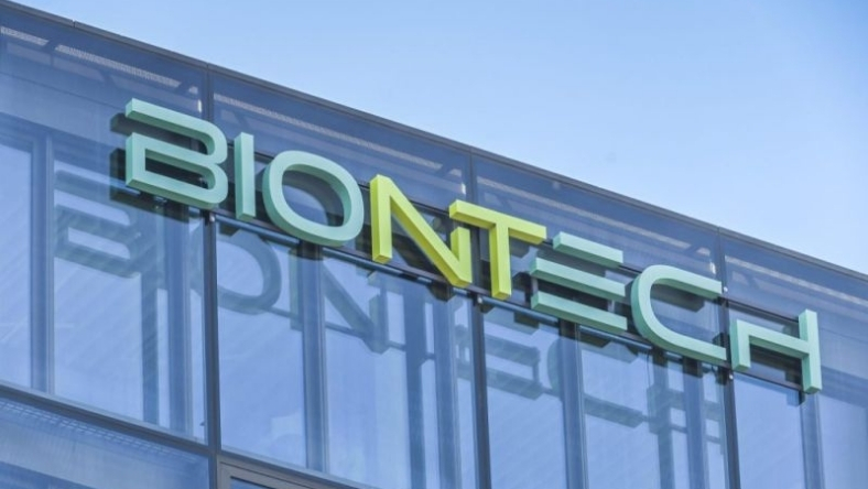 BioNTech logo displayed on modern glass office building exterior