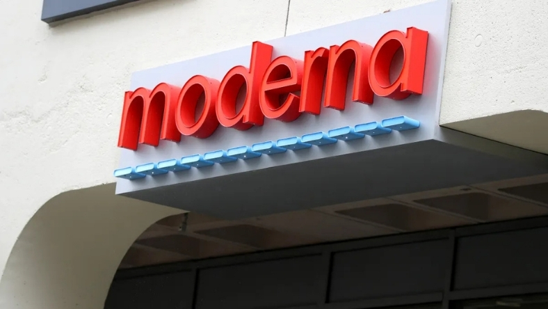 Red Moderna logo signage mounted on building exterior above entrance